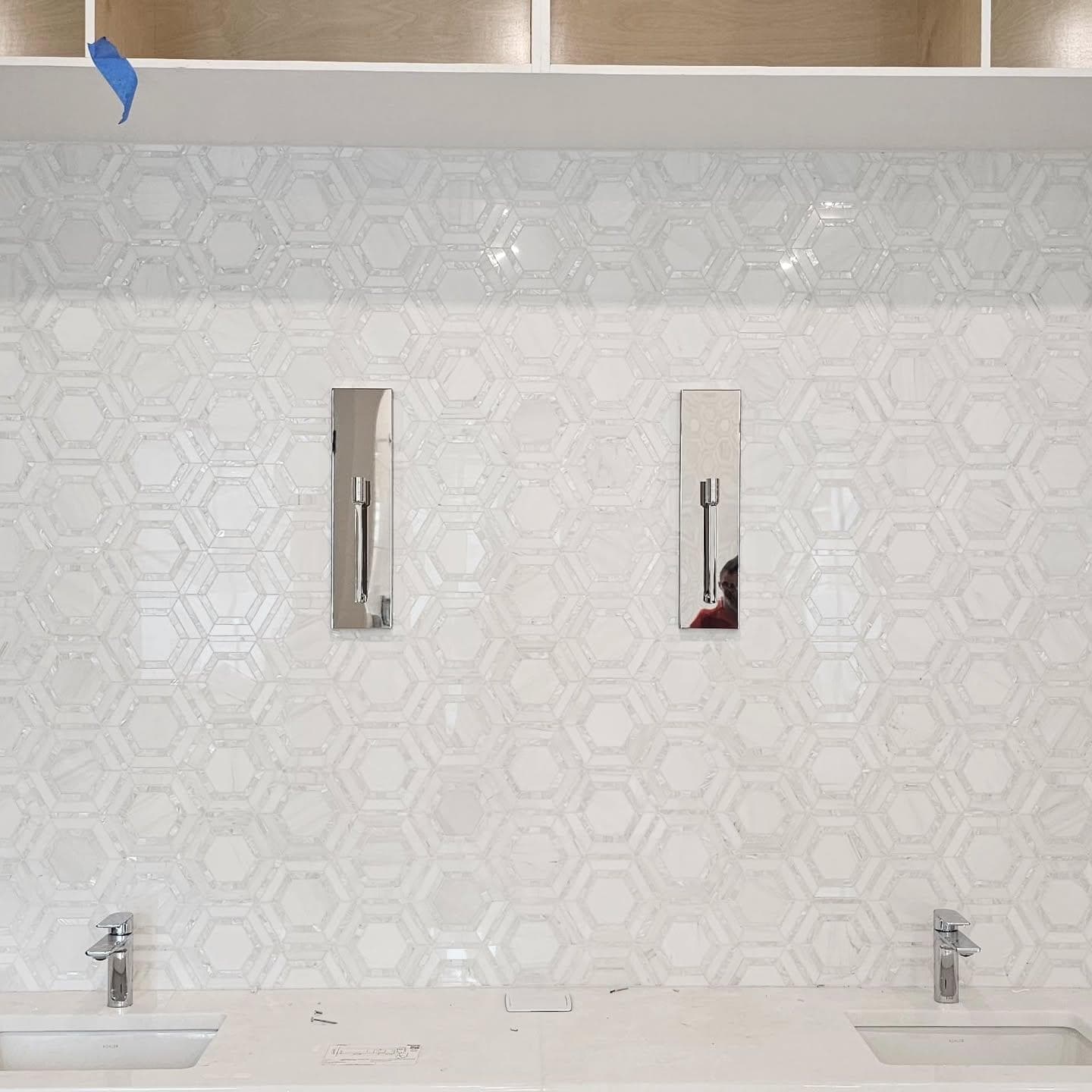 Glass hexagon mosaic backsplash with double vanity sinks