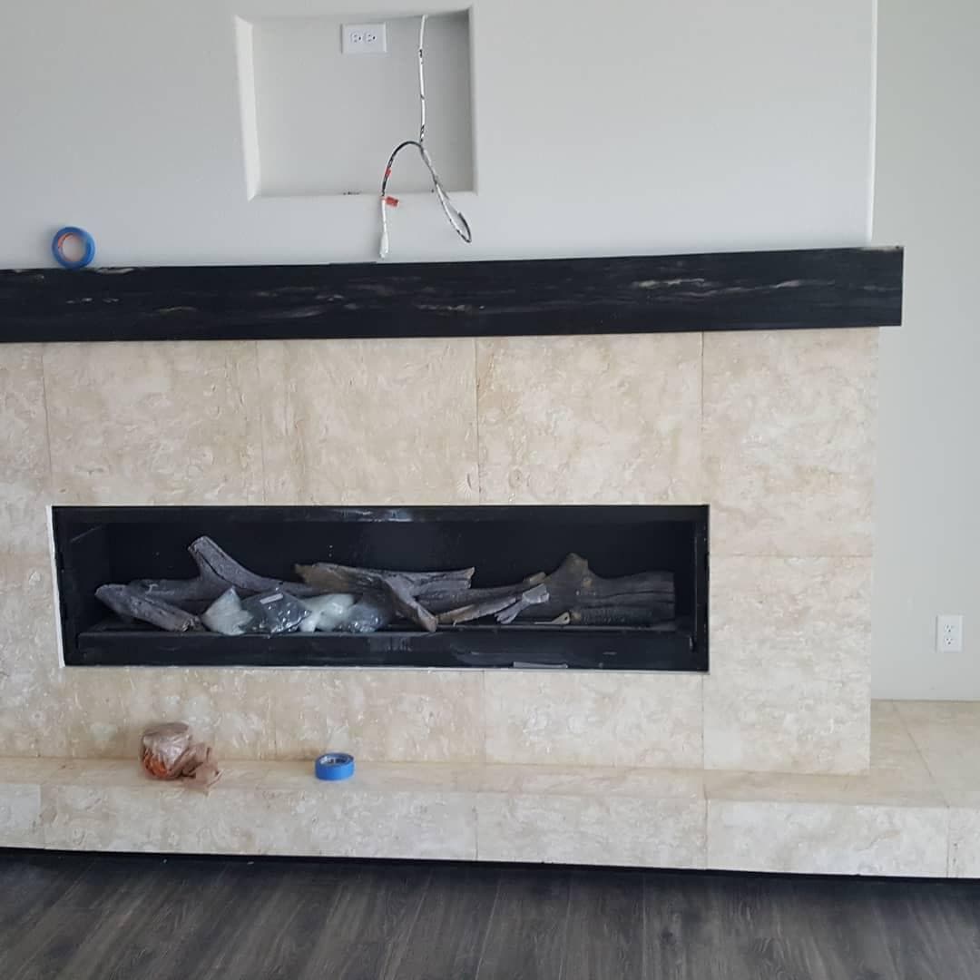 Travertine tile fireplace surround installation