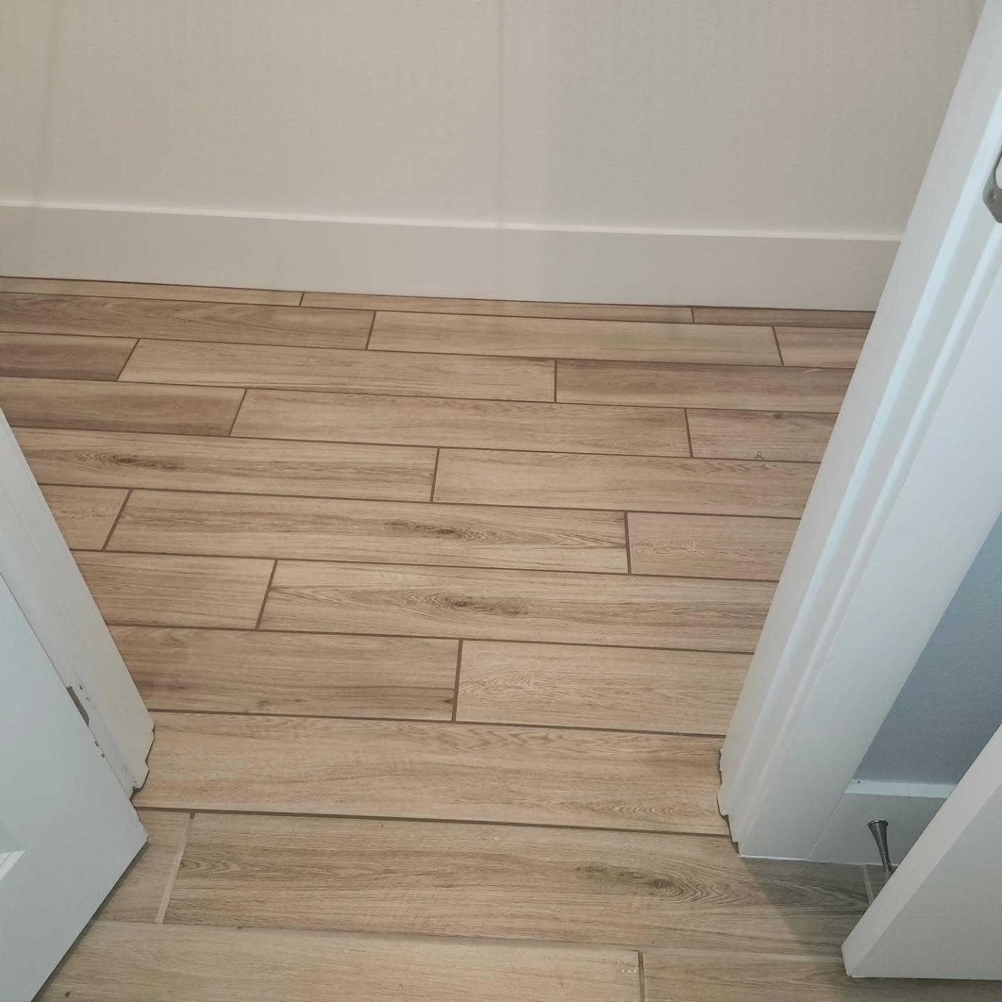 Wood-look plank tile flooring in hallway