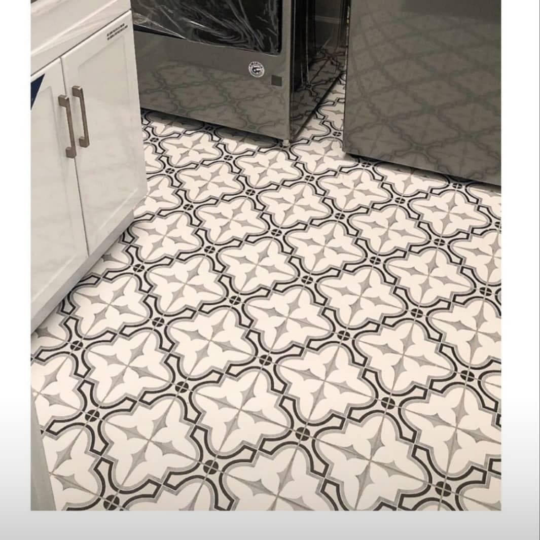 Black and white patterned tile laundry room floor