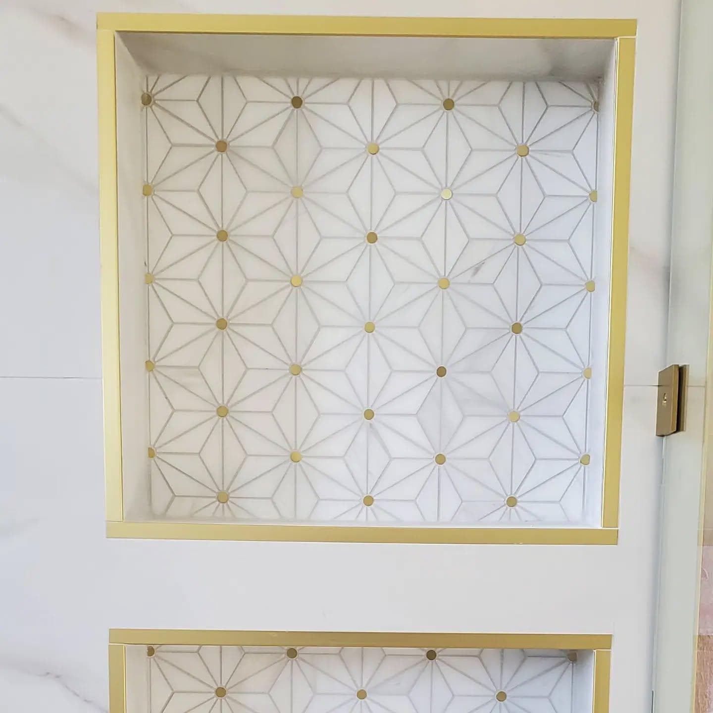 Gold-trimmed geometric star mosaic shower niche
