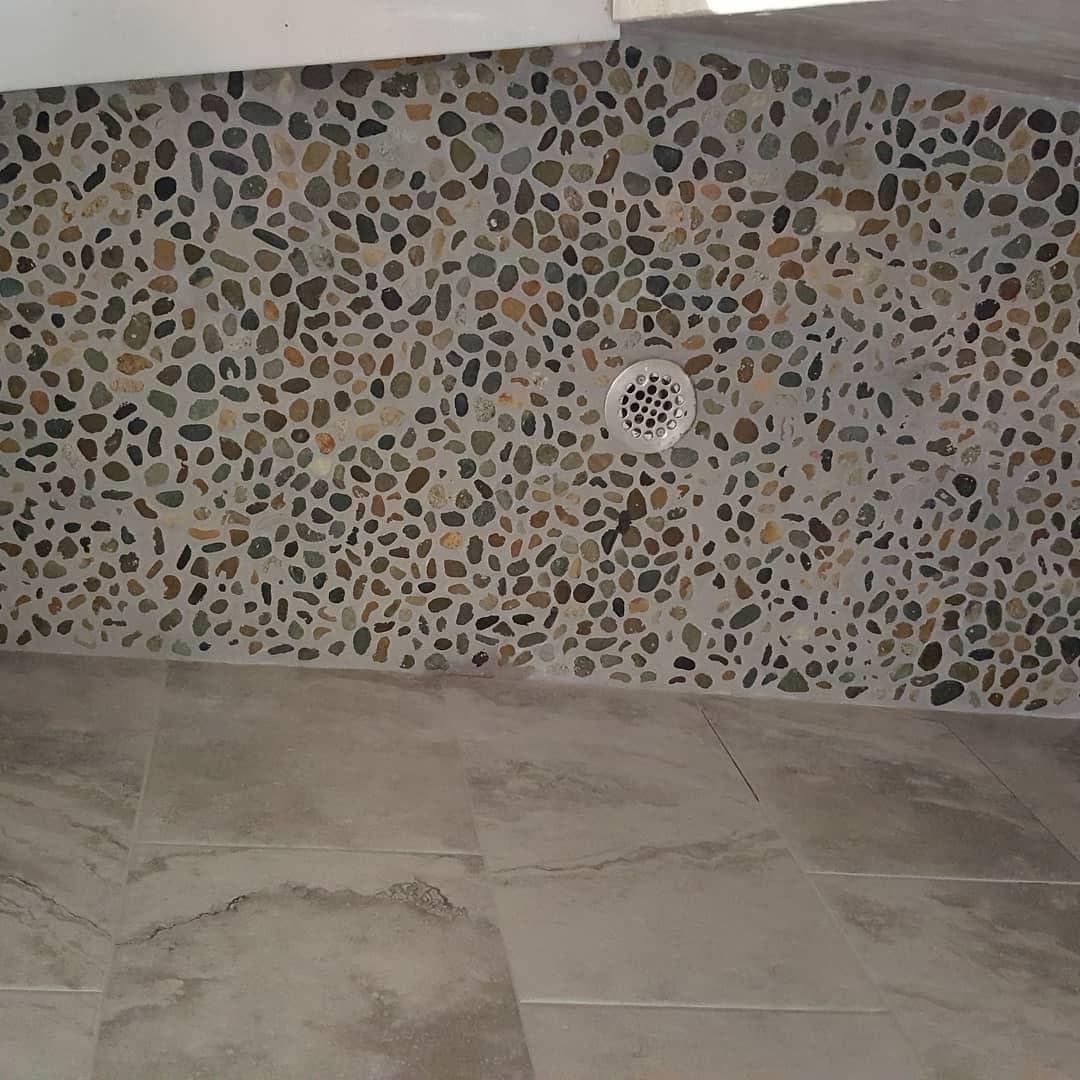 Natural pebble stone mosaic shower floor